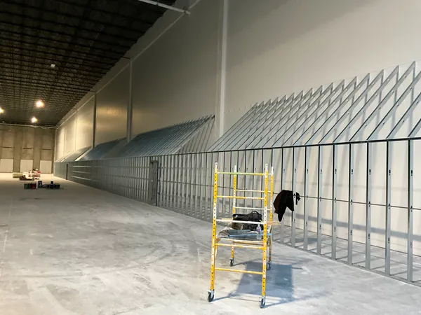 interior of a commercial building with a large fire-rated demising wall